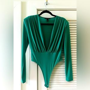 Stylish green V-neck bodysuit top!!! Polyester and spandex.